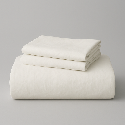 Stack of white folded sheets on a gray background